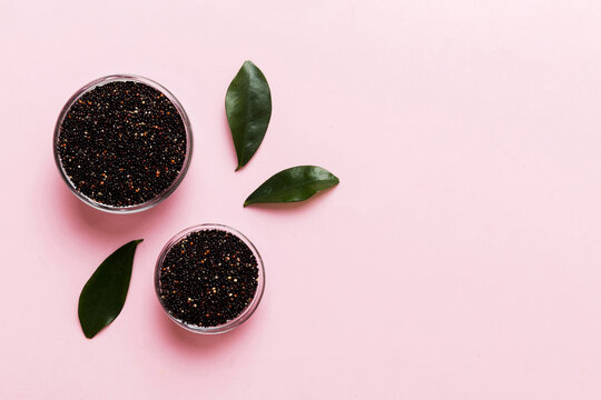 quinoa seeds in bowl on colored background. Healthy kinwa in small bowl. Healthy superfood