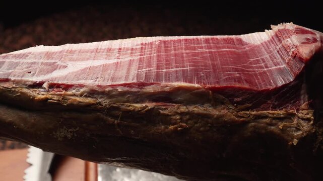 Slow Motion Orbit Shot of Sliced Iberian Ham on Stand, 4K