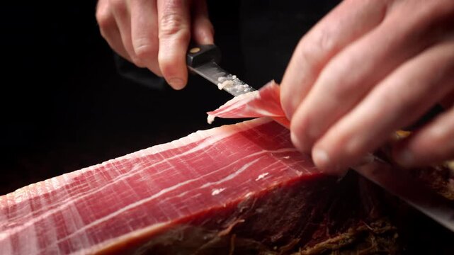 Extreme Close-Up of Iberian Ham Texture While Slicing, 4K Slow Motion