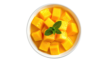 Overhead shot of a white bowl overflowing with vibrant diced tropical fruit and fresh herb garnish