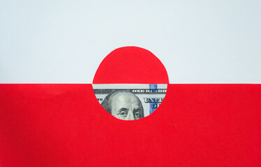Minimalistic image of the flag of Greenland and United States dollars. US and Greenland strategic interests in the Arctic Region. Global politics and the division of the world.