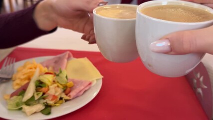 Morning, coffee and couple toast in home kitchen with conversation, cup and mug with drink. Relax, communication and love of people with cheers, house and marriage talking for breakfast plan with tea