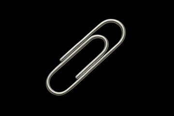 Obraz premium Metal paperclip on black background.
