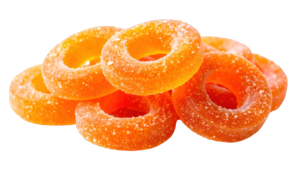 Pile of translucent orange ring-shaped candies, sugary coating, black background