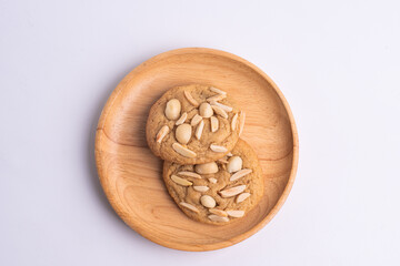 soft cookies with almond macadamia and chocolate on a table and plate