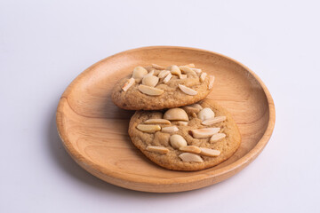 soft cookies with almond macadamia and chocolate on a table and plate