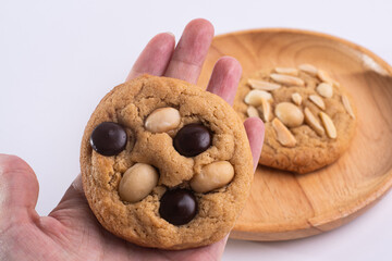 soft cookies with almond macadamia and chocolate on a table and plate