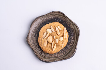 soft cookies with almond macadamia and chocolate on a table and plate