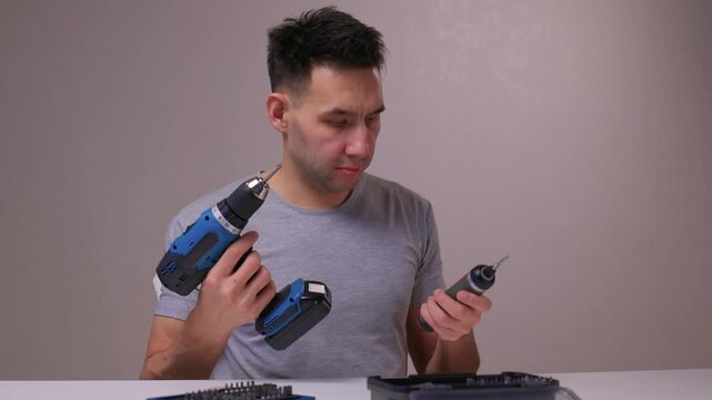 Closeup of hand choosing screwdriver pieces for detailed maintenance, Detailed scene of hand carefully selecting screwdriver bits for fine electronic or furniture repair