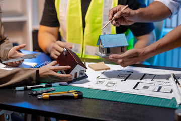 A team of architects and engineers coordinates on an architectural project, reviewing design concepts and technical plans to ensure efficiency and creativity in modern construction development.