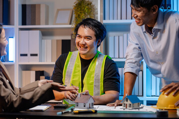 A team of architects and engineers coordinates on an architectural project, reviewing design concepts and technical plans to ensure efficiency and creativity in modern construction development.