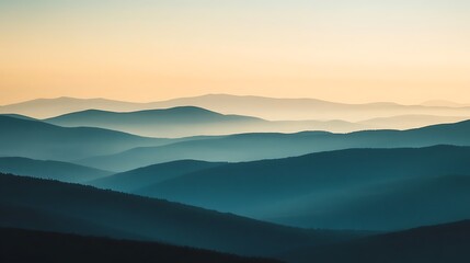 Hazy mountain landscape silhouette under pastel sunrise or sunset sky