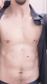 Headless man put on black short sleeve shirt