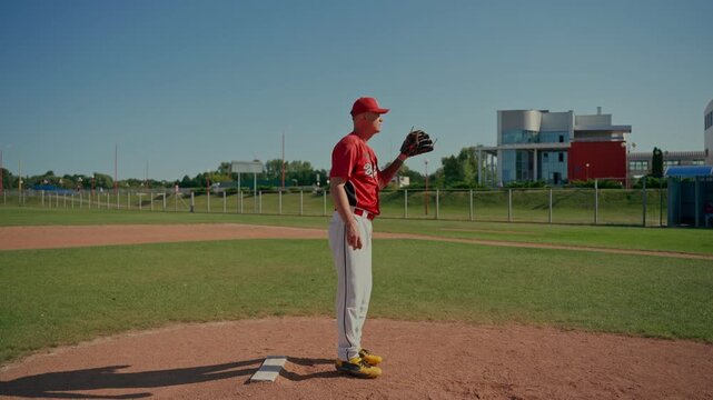 The pitcher practices throwing the ball. The baseball players train by playing.
