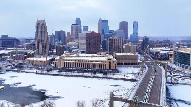 Hennepin Avenue Bridge and Minneapolis Post Office in Winter with Downtown Skyline in Aerial View