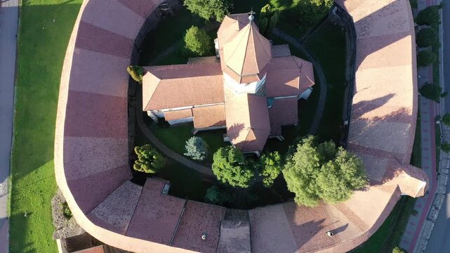 Aerial view of the Fortified church surrounded by concentric walls and lush green trees, a historic site, Prejmer, Brasov, Romania.