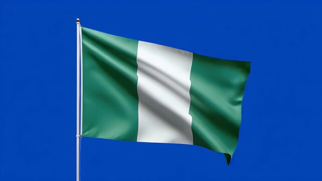 Nigerian flag waving dynamically against a plain blue screen background, symbolizing national pride and independence day celebrations