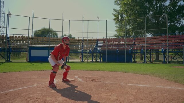 The catcher catches the ball and at that moment the defender runs up to him. The baseball players train by playing.