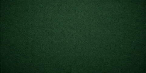 A macro shot of a blank green felt fabric texture reveals a rough velvet material surface with a subtle grunge pattern for an empty poker table backdrop or textile design wallpaper © lima