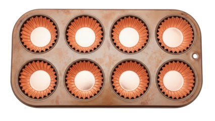 Copper muffin tin with orange paper liners isolated PNG, baking equipment for cupcakes and desserts on transparent background