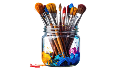 Close-up of art paintbrushes in a jar, splashes of colorful paint visible at the bottom of the glass container