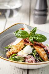 Grilled chicken salad with basil and cheese