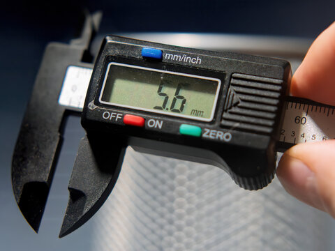Precision Measurement with Digital Caliper Showing 5.6 mm Reading
