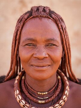 Portrait of a Himba woman with traditional namibian hairstyle and necklaces