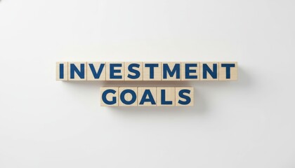 Wooden letter blocks spelling investment and goals on a clean white background, symbolizing financial planning, wealth management, savings and long term business strategy