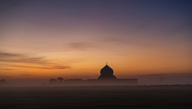 Silhouette of a dome building against a vibrant sunset sky. - Powered by Adobe