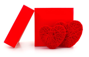 Two red yarn hearts with gift box isolated on white background