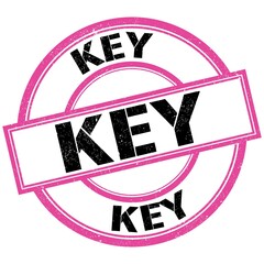 KEY text on pink-black round stamp sign