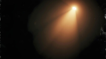 A dramatic warm spotlight cuts through the dense darkness, creating a powerful beam of light and a hazy atmospheric glow against a textured black background