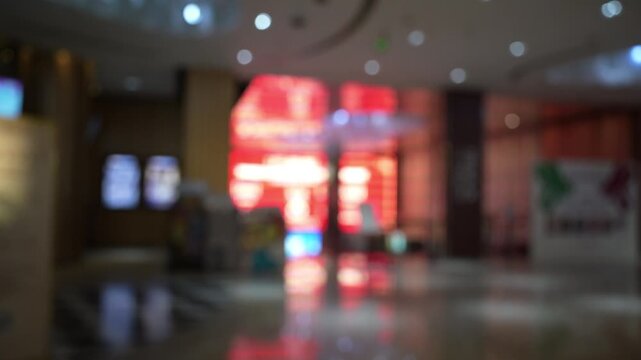 Blurred view of movie theater lobby entrance interior cinema concept.