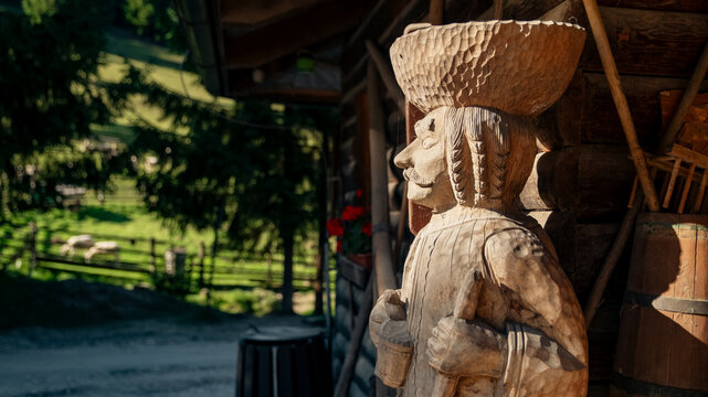 Traditional wooden folk statue outside rural house in Cutkovska dolina village