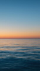 Obraz premium Serene ocean sunset tranquility mobile wallpaper