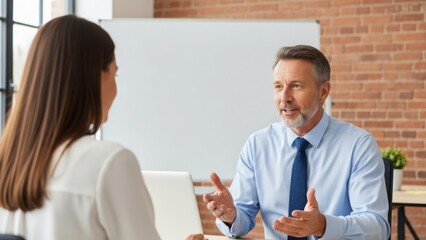 Man discussing with woman in office setting