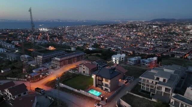 Cinematic night footage of a luxury villa with warm exterior lighting, showcasing modern residential architecture and elegant nighttime ambiance. Perfect for real estate, lifestyle, and premium proper