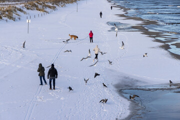 Winter walkers on the Baltic Sea coast of Usedom 