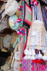 Colorful Traditional Handmade Bags and Souvenirs at a Market Stall
