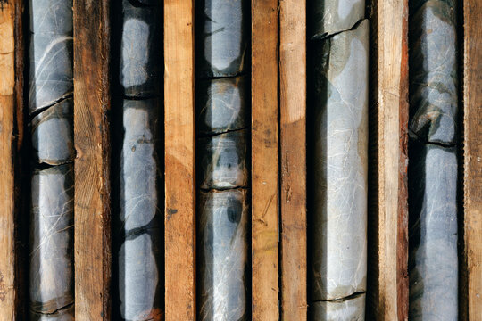 Mining geology exploration of minerals after drilling. Core samples in geological laboratory.