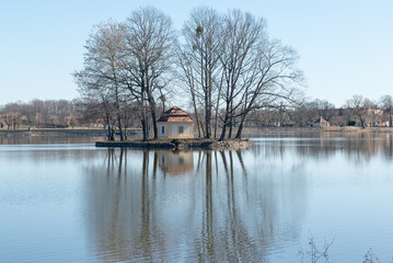 Fototapeta premium house on the lake. Swan Lake with a house