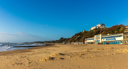 West Cliff Beach, Bournemouth, UK - December 25th 2025: Seafront buildings facing an empty beach.