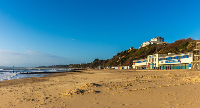West Cliff Beach, Bournemouth, UK - December 25th 2025: Seafront buildings facing an empty beach.