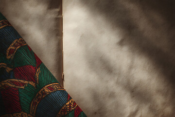 african heritage design, heritage symbols and pan-african colors lend depth to the atmospheric composition, while muted tones create a serene backdrop for text