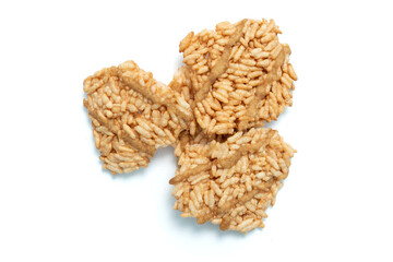 Thai crispy rice crackers with sweet caramel syrup isolated on white background. Top view.