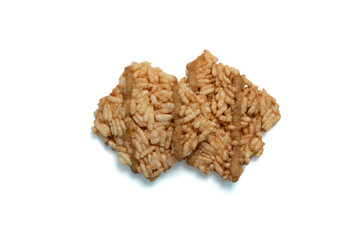 Thai crispy rice crackers with sweet caramel syrup isolated on white background. Top view.