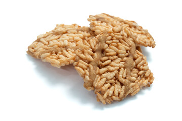 Thai crispy rice crackers with sweet caramel syrup isolated on white background.