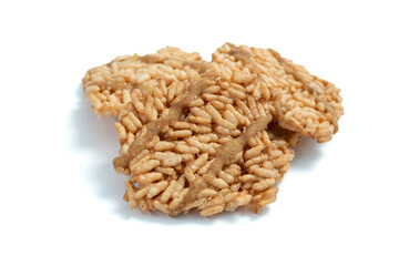 Thai crispy rice crackers with sweet caramel syrup isolated on white background.