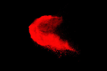 red powder explosion isolated on black background